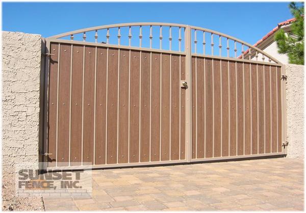 A gate that is open and closed on the side of the road.