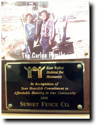 A plaque with the name of carlos and a picture of him.